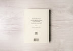 Book with text on a wooden surface
