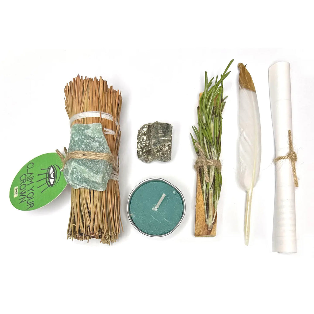 Set of items including sticks, a candle, a feather, and a stone on a white background