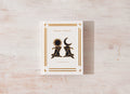 Dream journal with sun and moon design on a wooden surface