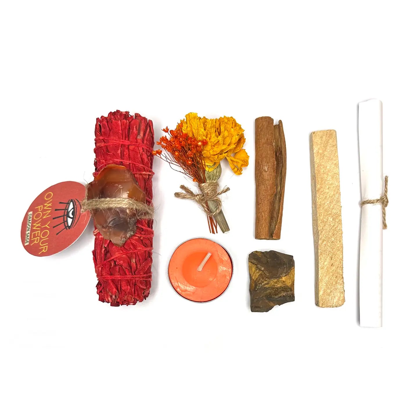 Collection of ritual items including incense sticks, candles, and stones on a white background