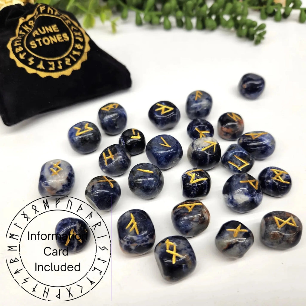 Set of blue stone runes with gold symbols on a white surface, accompanied by a black pouch labeled 'Rune Stones'.