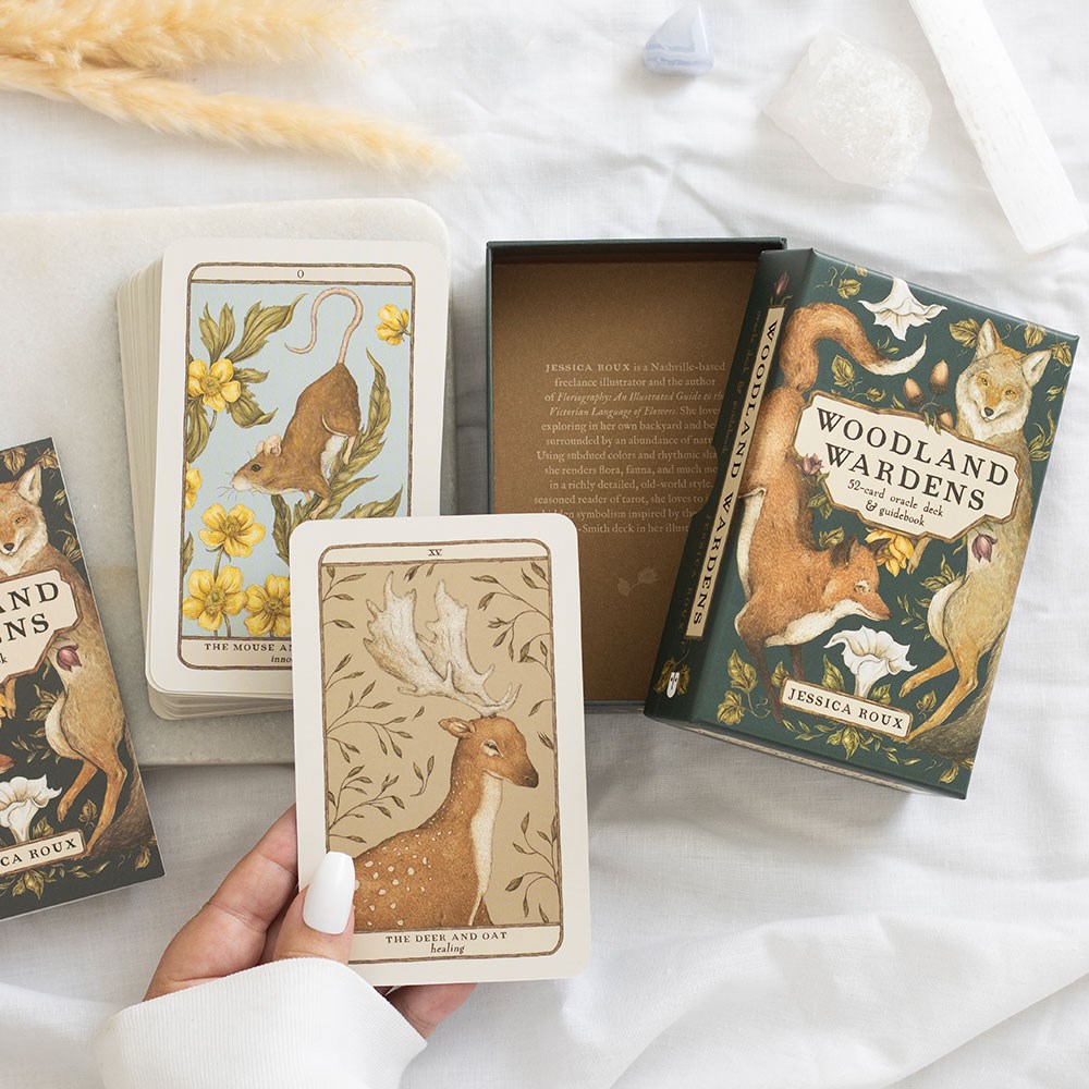 Woodland-themed card game with cards and box on a white surface